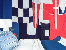 Flags Arranged on Bedroom Wall Add Color and Contrast