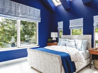 Skylights and Multiple Windows Brighten Blue Bedroom