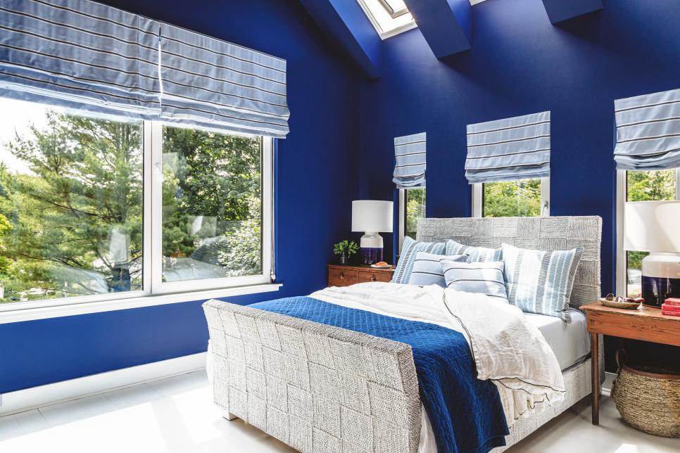 Skylights and Multiple Windows Brighten Blue Bedroom