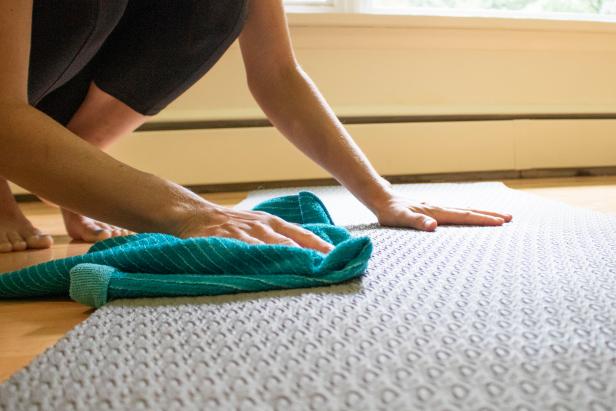 Spray and wipe down your yoga mat to disinfect it after class.