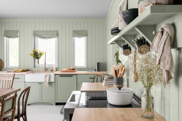 Green Eat-In Kitchen Features Wood-Paneled Walls