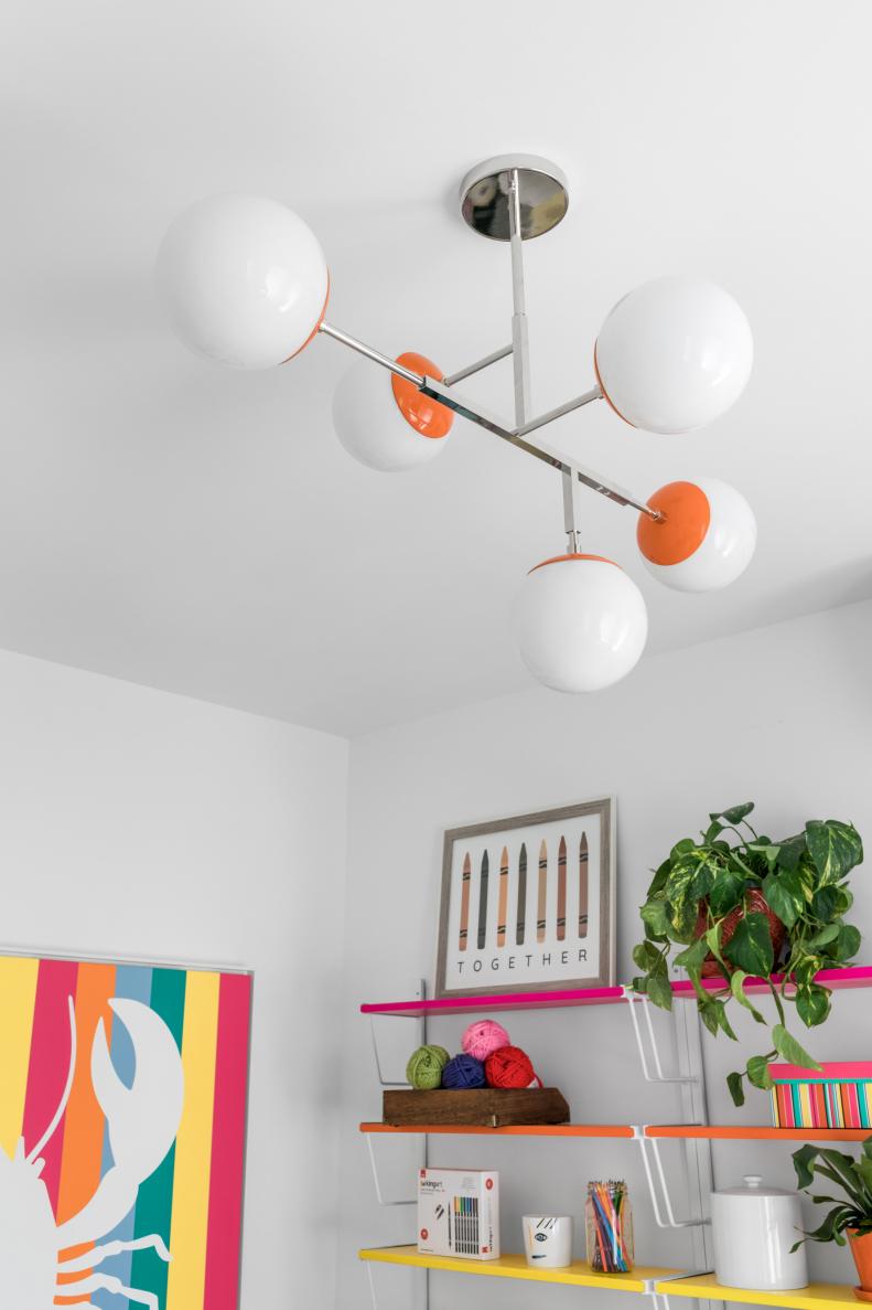 Orange-Accented Globe-Light Fixture in White Contemporary Studio