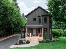 Head-On View of Front of Gray Home With Pine-Wood-Framed Porch