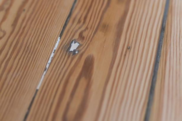Each round of sanding will reveal a smoother surface with all repaired holes or cracks flush with the floor surface.