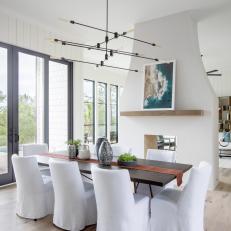 Contemporary Dining Room With Double Sided Fireplace