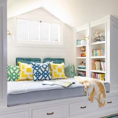 Attic Reading Nook With Yellow Pillows