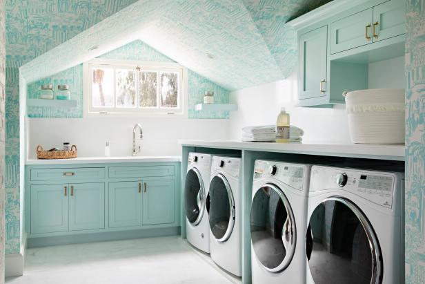 Classic cottage laundry room features a white and gray granite