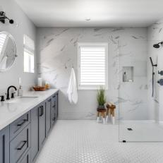 Minimalist White Master Bath With Glass Shower and Veined Stone Walls 