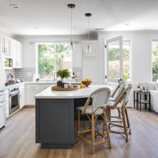 Curvaceous Custom Dining and Storage Island in Contemporary Coastal Kitchen 