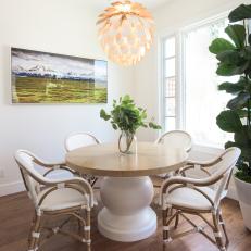 Eclectic Dining Room With Blossom Pendant