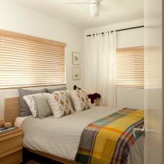 Guest Bedroom With Yellow Plaid Throw