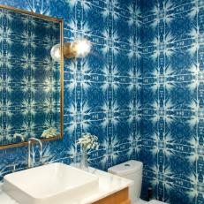 Blue Powder Room With White Flowers