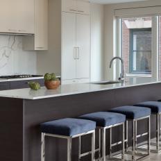 White Modern Kitchen With Blue Velvet Stools