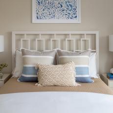 Neutral Coastal Bedroom With Striped Pillows