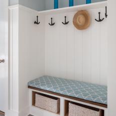 Blue Coastal Mudroom With Glass Bottles