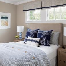 Tan Coastal Bedroom With Striped Lamps