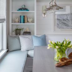 Coastal Neutral Dining Area With Blue Pillows