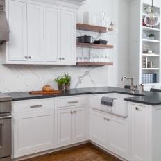 White Open Plan Kitchen With Black Countertops