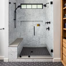 Neutral Primary Bathroom With Black Tile Floor