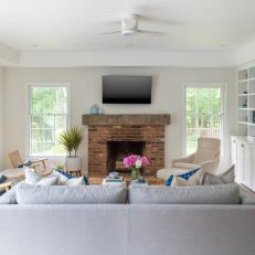 White Coastal Living Room With Brick Fireplace