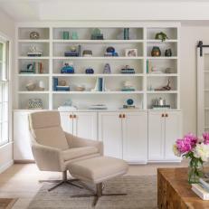 White Armchair and Built In Bookshelf