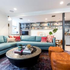Eclectic Living Room With Blue Sectional