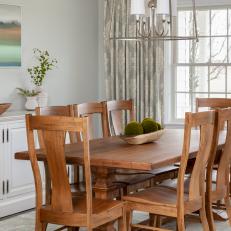 Gray Transitional Dining Room With Blue Art