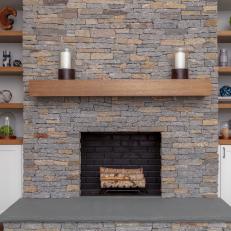 Stone Fireplace With White Candles
