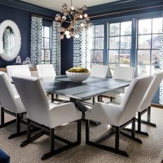 Blue Contemporary Dining Room With White Mirror