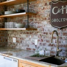 Kitchen With Exposed Brick and Herbs