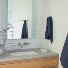White Bathroom With Blue Hand Towels