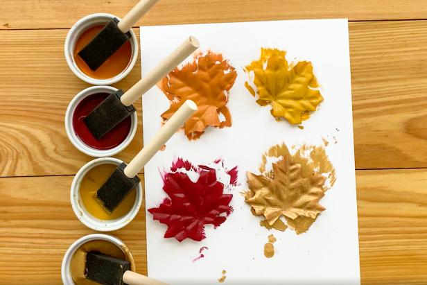 Paint the faux fall leaves with autumn-inspired colors like gold, red, orange and yellow.