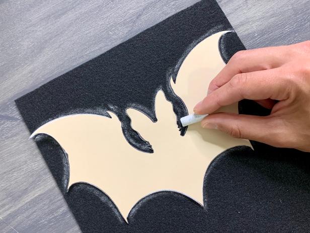 Use a piece of chalk to trace the template onto a black piece of felt. TIP: No chalk, no problem! Trace with a Sharpie or pen and flip over your image so there are no trace lines.
