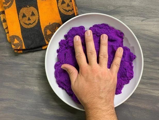 Press the object or your hand object into the sand slowly and firmly in the middle of the bowl being careful not to wiggle the surrounding sand. Then slowly remove the object from the sand. Place the bowl into the freezer for 30 minutes allowing the sand to chill and harden. TIP: Take your time with this step, any wiggling or shifting will distort details.