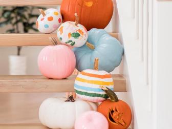 Sugar and Cloth blogger Ashley Rose painted (and carved!) an array of mini pumpkins in shades of pastels. Then she stacked them on her staircase for a layered Hallo-cute look. 