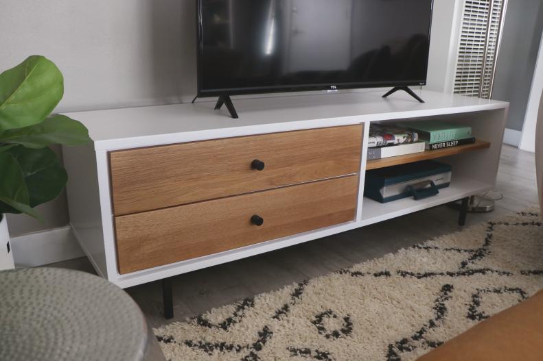 White and Wooden TV Console in Living Room With Neutral Rug