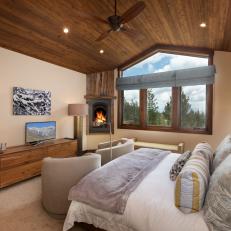 Rustic Contemporary Bedroom With Corner Fireplace