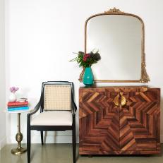 Wood Cabinet and Black Caned Chair