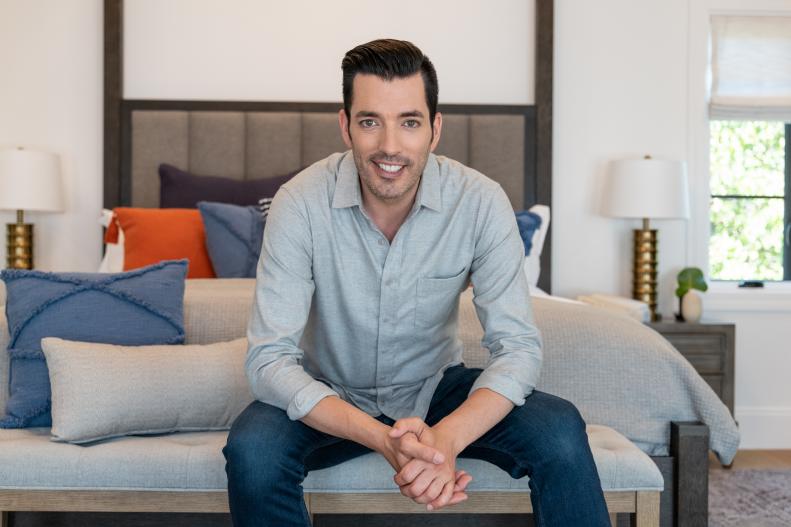 A portrait of Jonathan Scott in the master bedroom of his newly renovated house, as seen on Brother vs Brother.