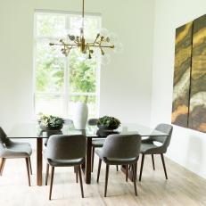 Contemporary Dining Room With Gold Art