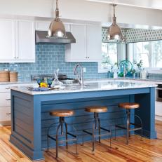 Blue and White Transitional Kitchen With Industrial Pendants