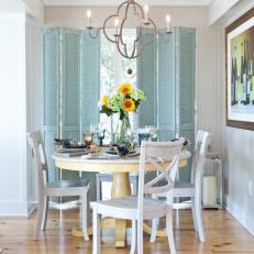 Coastal Dining Area With Blue Shutters