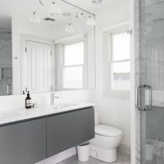 Gray and White Modern Bathroom With White Mat