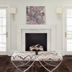 White Living Room Fireplace and Purple Art