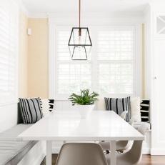 Neutral Breakfast Nook With Black Striped Pillows