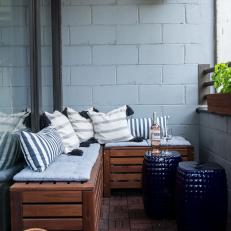 Industrial Balcony With Blue Ceramic Stools