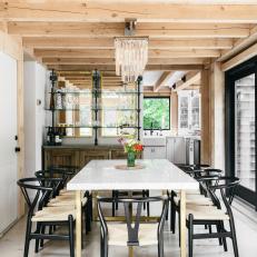 Rustic Contemporary Dining Room With Black Chairs