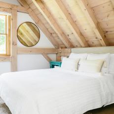 Neutral Scandinavian Bedroom With Blue Nightstand