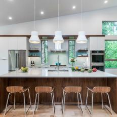 Modern Open Plan Kitchen With White Pendants