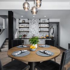 Gray Kitchen and Dining Area With Open Shelving
